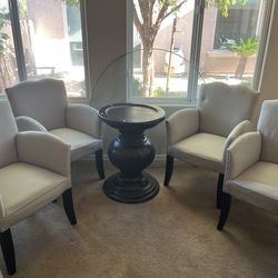 Round Pedestal Glass Dining Table and 4 SAFAVIEH Dining Toulon Tan Linen Arm Chairs
