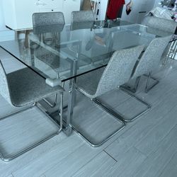 CB2 Dinning Set. 6 Chairs And Glass Table 