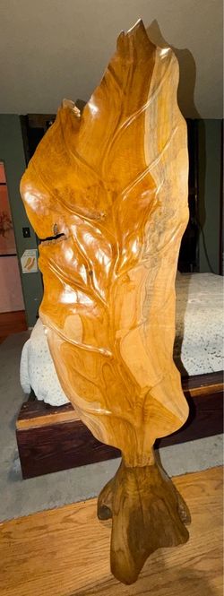 Large hand carved teakwood leaf stand up sculpture with tree stump base