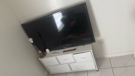 Samsung TV nd wall started and dresser