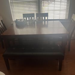 Table With Four Chairs And Bench With Leaf Built In (leather Cushions )