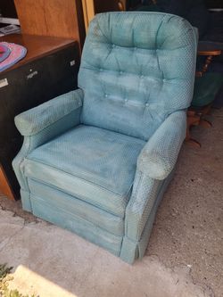 Recliner: mint green textured fabric recliner features a wooden handle and an extended footrest 
Pick up 5 miles west of Janesville