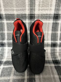 Black Peloton shoes with a single wide strap