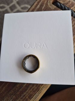 Oura ring with charger. Size 9 Gold. Make your best offer
