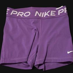 purple nike pros. size small