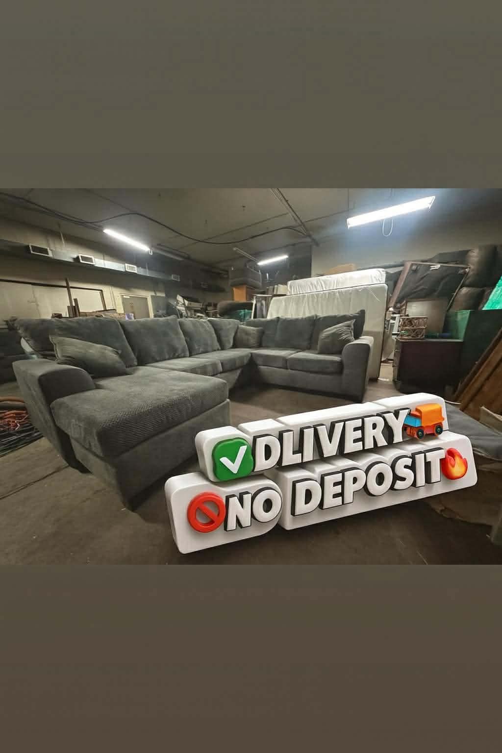 Beautiful Gray And Leather U-Shaped Sectional Floor Model