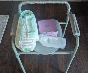 FREE - Unused bedside commode and liners.