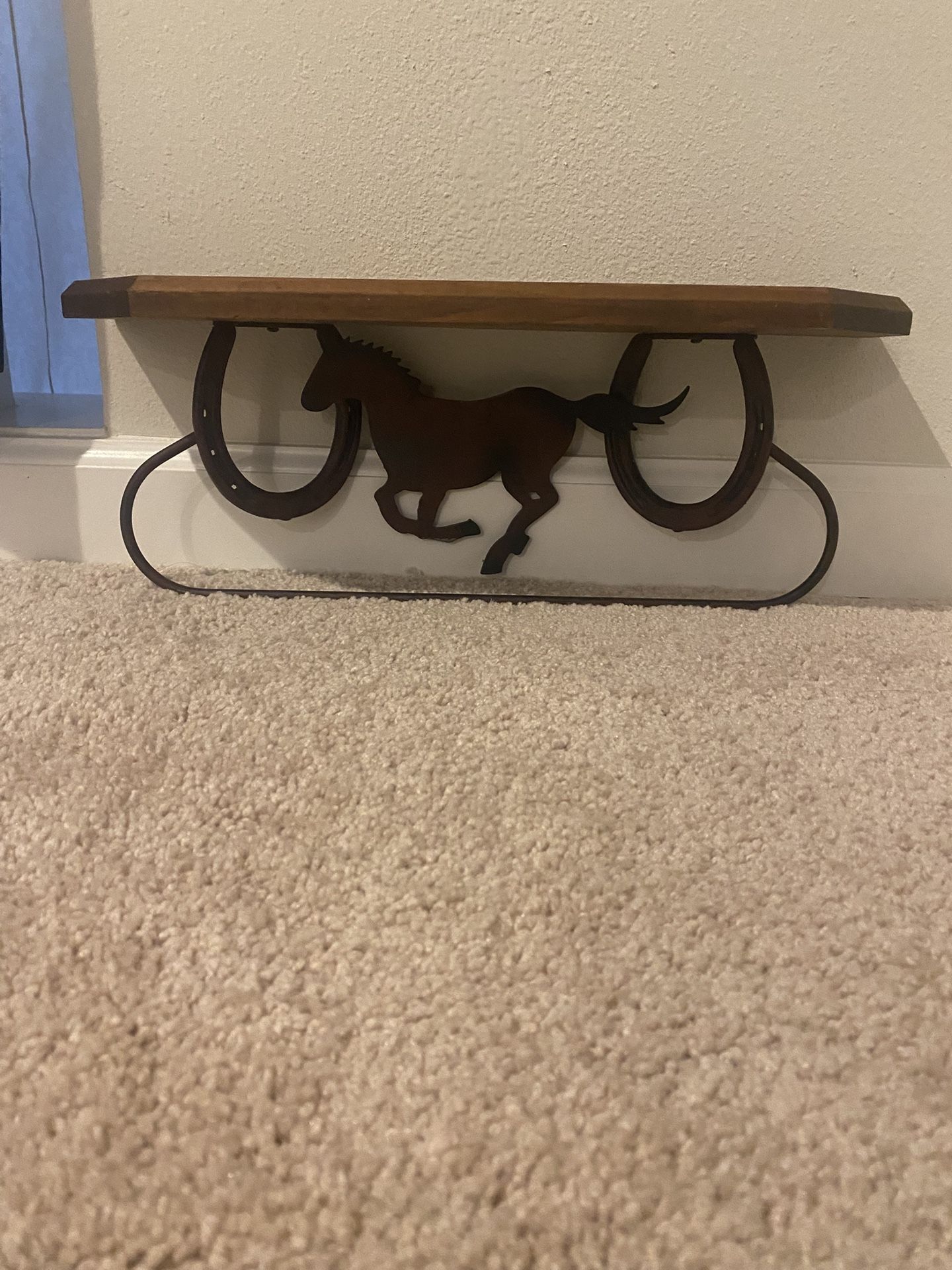 Rustic western style, wood and metal wall shelves with running horseand horseshoe accent include hanging bar for towels