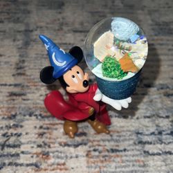 Authentic Mickey Mouse Fantasia holding a working Snow Globe