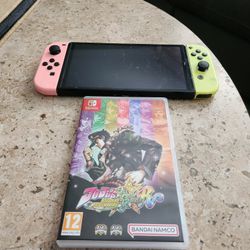 Nintendo Switch OLED (Pastel Pink/Green) w/ Jojo's Game