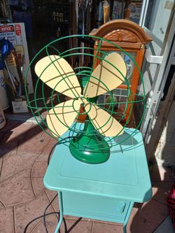 vintage green metal electric table fan