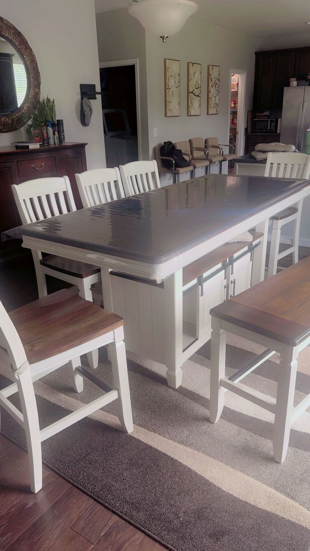 Wooden dinning table with chairs and bench.
