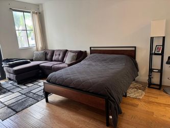 Wooden bed frame and three-seat couch with L section