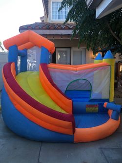 Kids bounce house with slide.