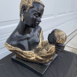 Painted mother and child Statue