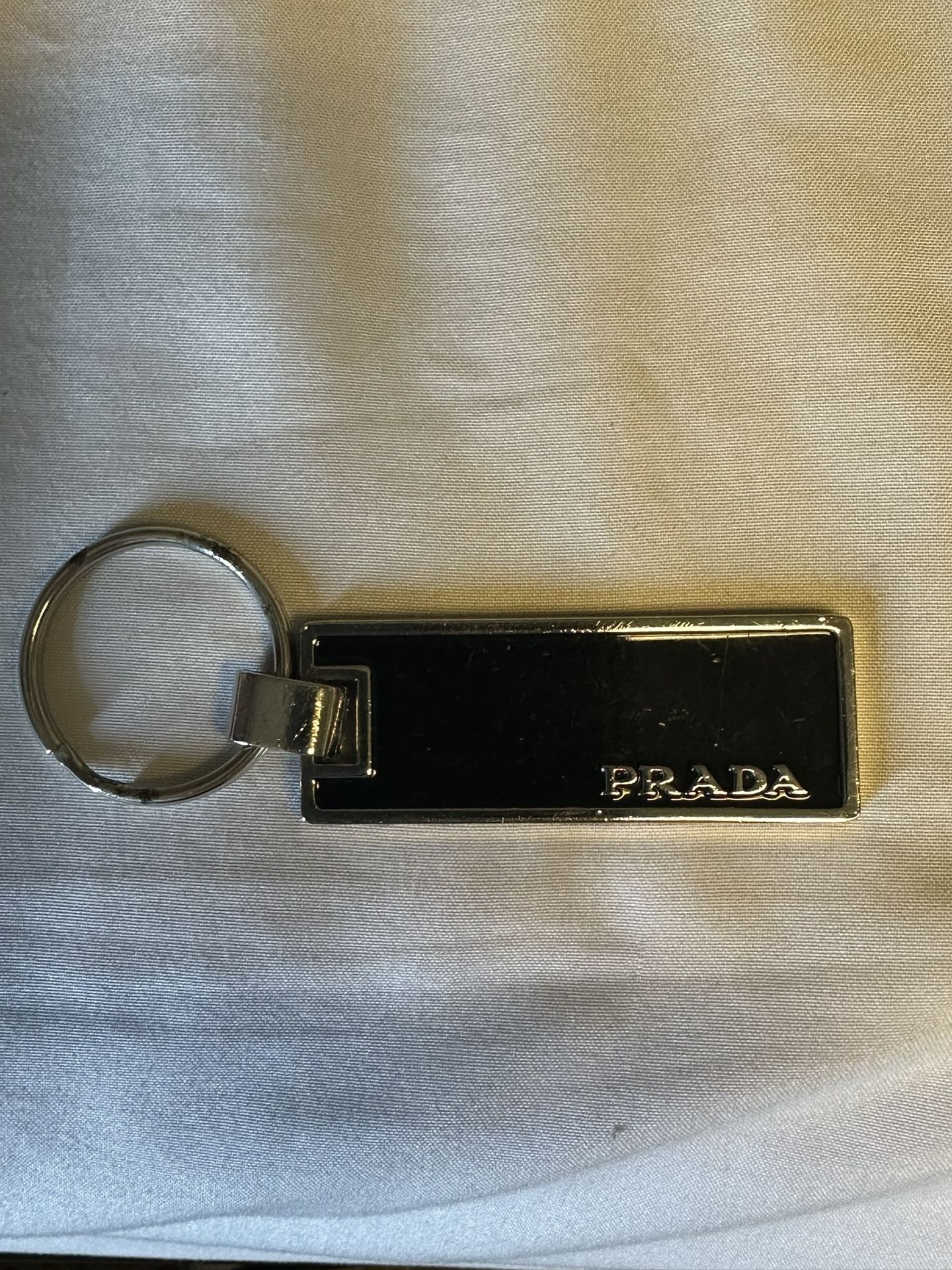 Authentic Prada Silver & Black Enamel Keychain
