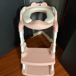 baby over the toilet