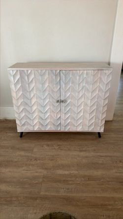 Whitewashed Wood Cabinet with Chevron Doors