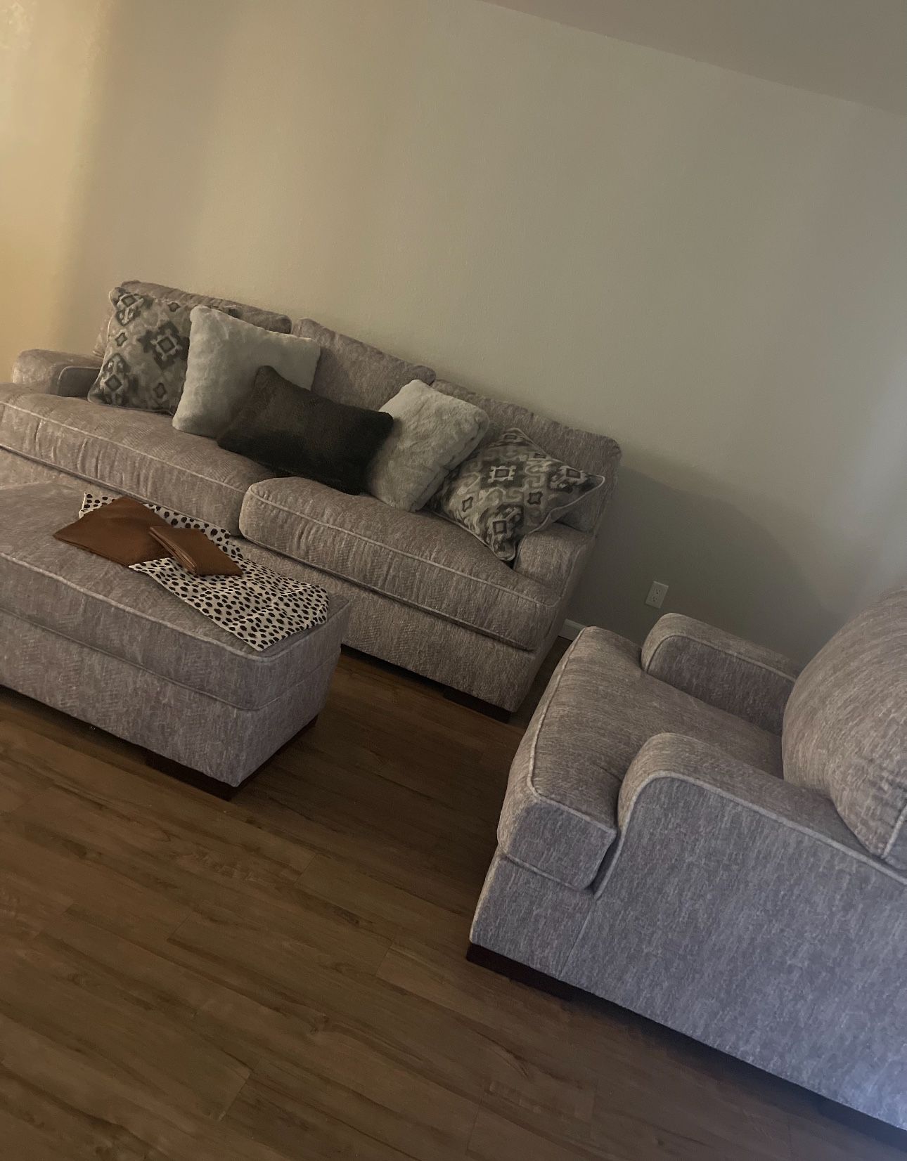 Gray sofa w/ over sized chair and ottoman