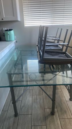Glass table with 5 chairs