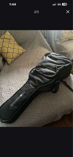 black and white guitar with case