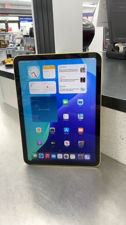 yellow Apple iPad (10th generation) with 64GB of storage.