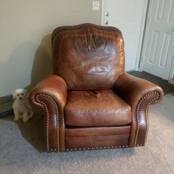 Comfortable Leather Couch And A Nice Orange Chair