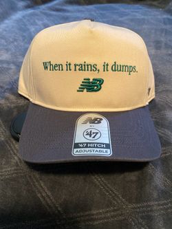 Cal Raleigh New Balance Hat “When it rains, it dumps.”