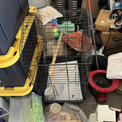 Big Black Bird Cage With Toys And Dishes As Well As 2 Perches 