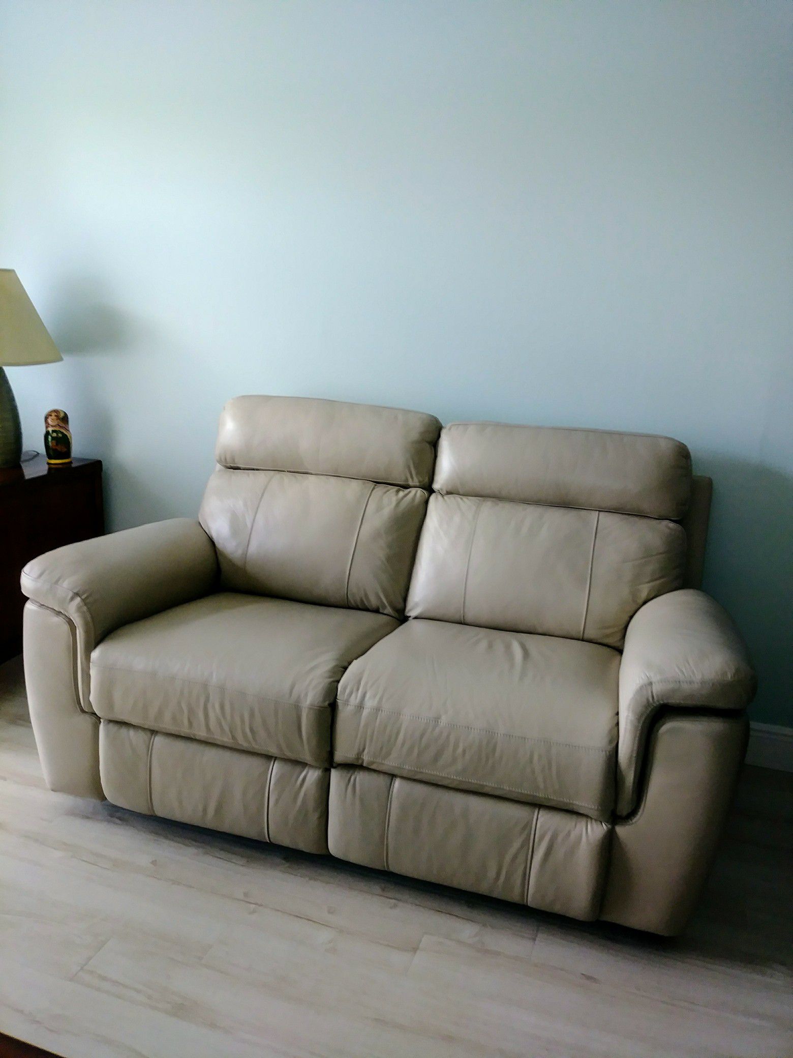 Moving Sale! Gently used, leather loveseat, double recliner. It measures 65" L x 36" D. One seat has electric power one manual power.