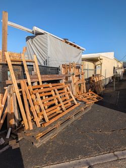 Free Large Lot of Reclaimed Lumber and Wood Pallets - FREE