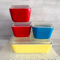 Vintage Pyrex Primary colors refrigerator dish set 1 yellow 503, 1 blue 502 and 2 red 501. All have lids.