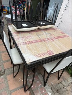 4 chairs metal dining table glass top