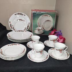 Poinsettia and Ribbons Christmas China by Tienshan with 4 place settings. 