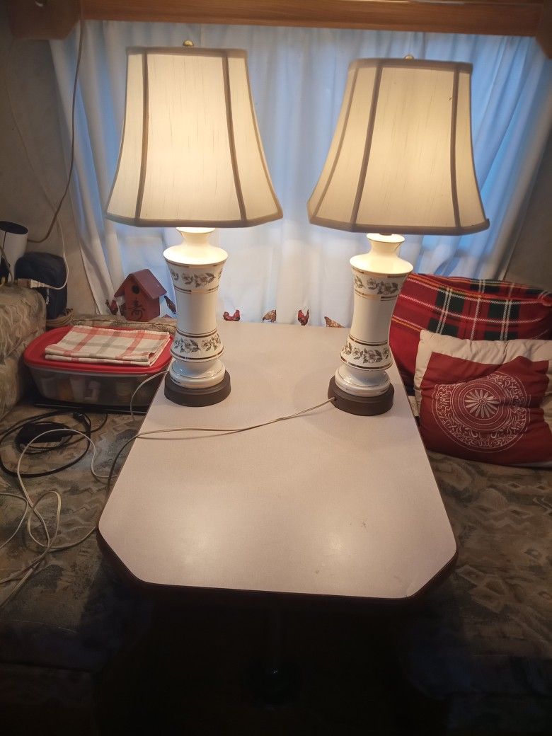 Antique Porcelain Table Lamps With Linen Shades and Brass Finials.