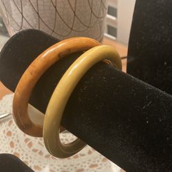 2- Vintage “Bakelite”bangle bracelets in yellow/mustard and brown swirl colors.  (Johnstown Ohio)