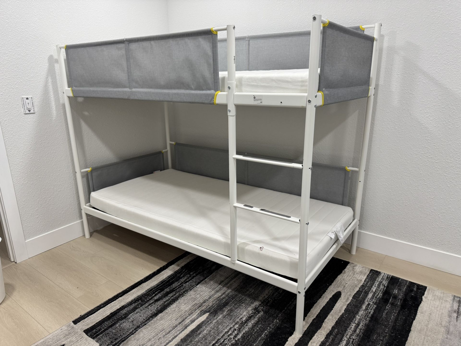 Bunk bed with mattresses