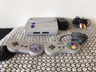 Super Nintendo (Original System) all the cables and cords and two controllers