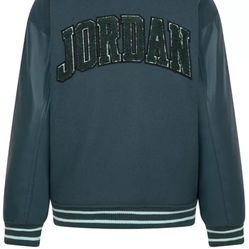 Jordan's varsity baseball jacket features striped ribbed trim and sleek faux-leather sleeves.