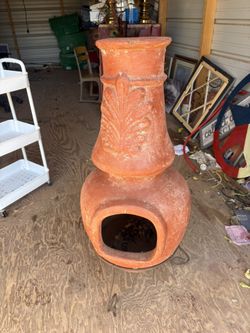 This is a terracotta clay chiminea