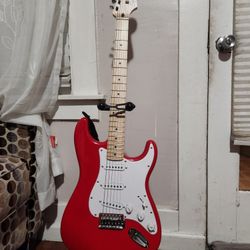 Red Stratocaster Guitar With Stand And Amp