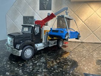 Driven Tow Truck and Sport car