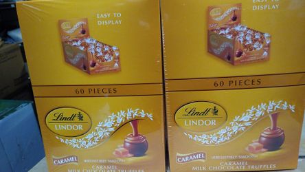 Lindt Carmel Milk Chocolate balls . 60 count .