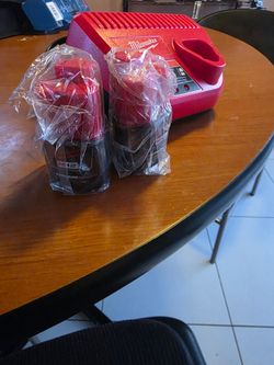 2, 2.0 Milwaukee M12 batteries. Brand new and charger