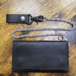 Brand new hand crafted genuine leather tri fold wallet with 24" stainless steel chain.

$75 FIRM