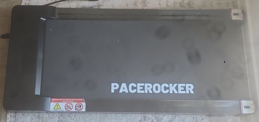 The black PACEROCKER Walking Pad Treadmill features an auto-incline design and digital display