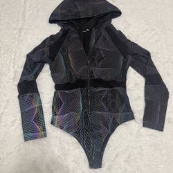 Black hooded rainbow light reflective one-piece bodysuit with zip-front closure. Iridescent geometric lpatterns   New 1x light reflective rainbow body