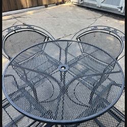 Wrought Iron Patio Set with 4 Curved Backed Rocking Chairs
