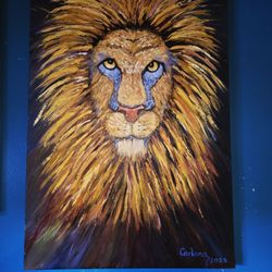 acrylic painting of a lion's face, created by an artist named "Carlana" in 2023. 24"×36"