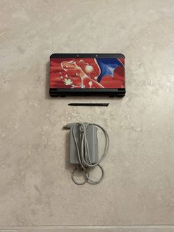 New Nintendo 3DS with Games and charizard plates